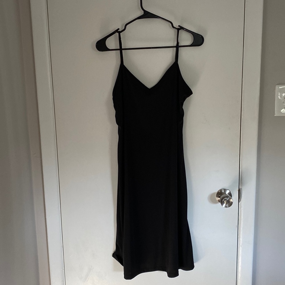 Black slip. Adjustable straps. Not sure brand or size but fit me & I wear size 8